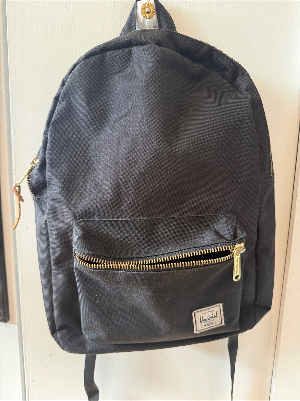 Herschel black and gold zips backpack